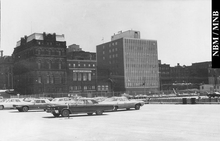 Corner of Water Street and Princess Street taken from the Department of Transport Wharf showing the Old Post Office building, Bank of Nova Scotia and National Harbours Board Building,  Saint John, New Brunswick