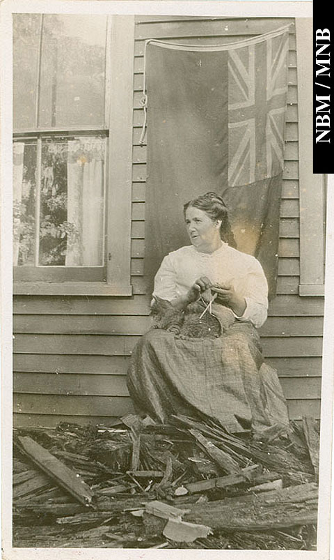 Otty Family Member Knitting and sitting with a cat on the ruins of the Old Veranda, Gagetown, Queens County, New Brunswick